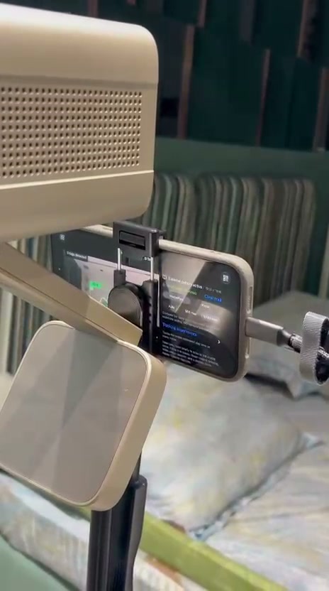 An iPhone mounted beneath a projector on the Playfield rig